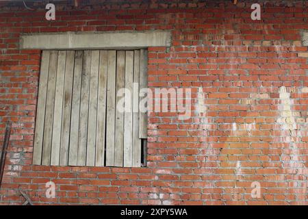 Boarded up window. abandoned and unfinished houses and buildings. Vacant buildings. Stock Photo