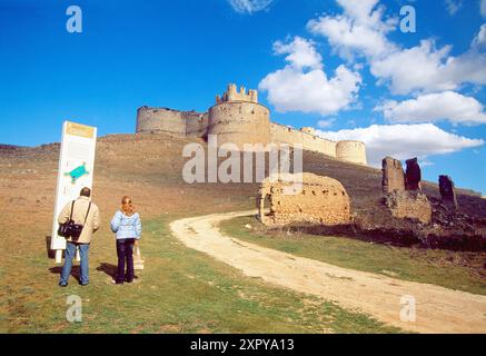 Couple of tourists visiting the ruins of Tovar castle. Berlanga de Duero, Soria province, Castilla Leon, Spain. Stock Photo