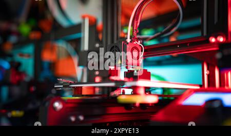 3D printer preparing object. Production prototype. Nozzle clese-up. Stock Photo
