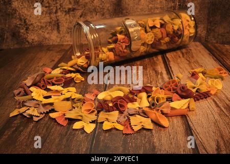 Different types of colorful pasta from a horizontal pasta container Stock Photo