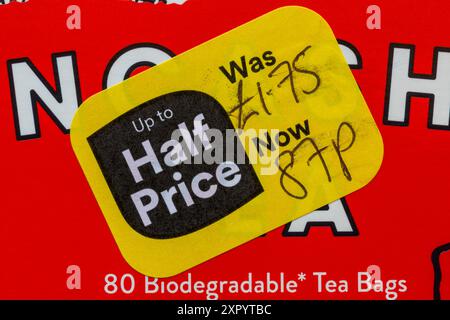 Reduced yellow sticker on box of Lancashire Tea teabags food was £1.75 now 87p, half price - price reduction, price mark down Stock Photo