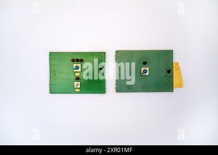 Old electrical cabinets and switches on white wall as copy space Stock Photo