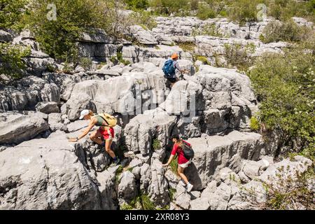 Climbing limestone fissures to Subra peak, Orjen Mountains, Herceg Novi, Montenegro Stock Photo