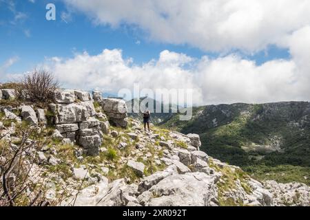 Climbing limestone fissures to Subra peak, Orjen Mountains, Herceg Novi, Montenegro Stock Photo