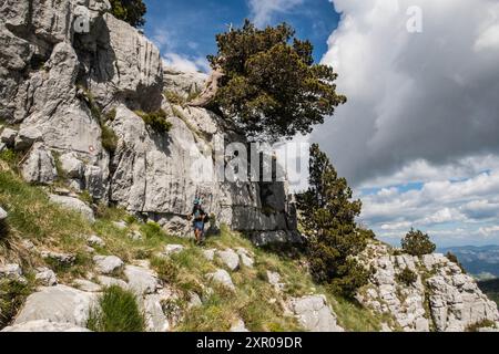 Climbing limestone fissures to Subra peak, Orjen Mountains, Herceg Novi, Montenegro Stock Photo