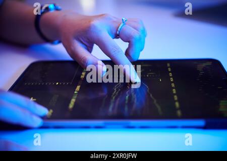 Analyzing Financial Data on Digital Tablet Stock Photo