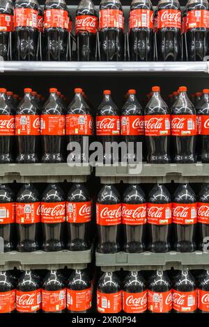 Plastic bottles of Coca-Cola for sale in a supermarket. Stock Photo