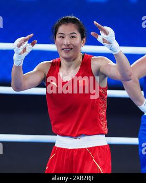 China's Li Qian celebrates after defeating Australia's Caitlin Parker ...
