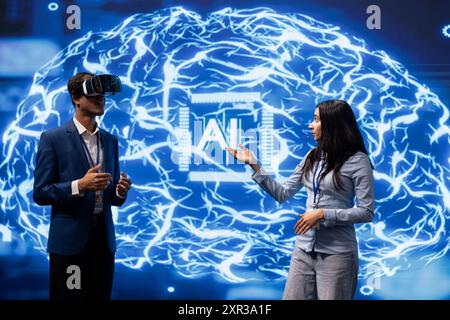 IT specialist coding in modern lab using VR tech, programming artificial intelligence computing simulating human brain. Programmer using virtual reality gear to build AI machine learning algorithms Stock Photo