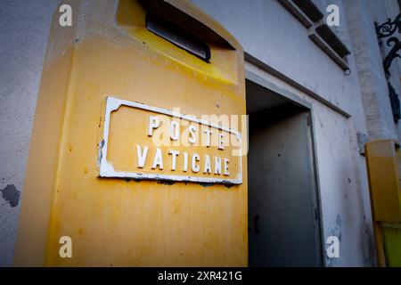 Picture of Poste Vaticane logo on their mailbox in Vatican city. Poste Vaticane is an organization responsible for postal service in Vatican City. The Stock Photo