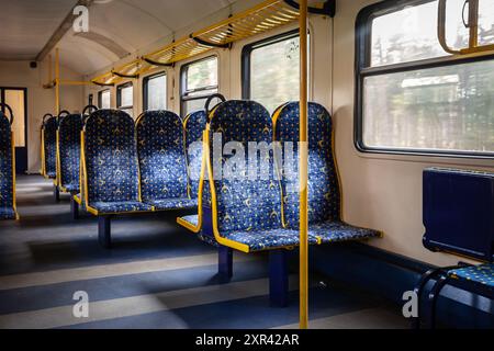 Picture of a typical seat from a refurbished European train,, en route in Riga, Latvia, Europe, in a regional EMU train. The interior of a Latvian sub Stock Photo