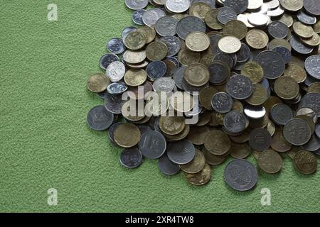 Terengganu, Malaysia - 23 August 2024 : Closeup of malaysian coins on green background Stock Photo