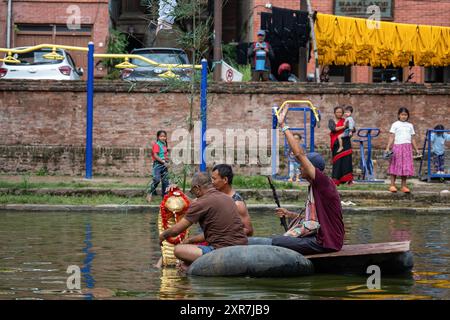 Bhaktapur, Bagmati, Nepal. 9th Aug, 2024. Locals of Bhaktapur worship the idol of serpent deity(snake) during Nag Panchami Festival. People on this day stick the poster of serpent deity(snake) on the main door step of the house, clean nearest local pond and worship snake gods, also called the Nagas during Nag Panchami. (Credit Image: © Amit Machamasi/ZUMA Press Wire) EDITORIAL USAGE ONLY! Not for Commercial USAGE! Credit: ZUMA Press, Inc./Alamy Live News Stock Photo