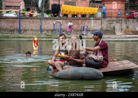 Bhaktapur, Bagmati, Nepal. 9th Aug, 2024. Locals of Bhaktapur worship the idol of serpent deity(snake) during Nag Panchami Festival. People on this day stick the poster of serpent deity(snake) on the main door step of the house, clean nearest local pond and worship snake gods, also called the Nagas during Nag Panchami. (Credit Image: © Amit Machamasi/ZUMA Press Wire) EDITORIAL USAGE ONLY! Not for Commercial USAGE! Credit: ZUMA Press, Inc./Alamy Live News Stock Photo