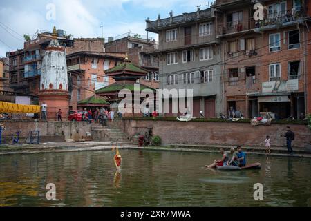 Bhaktapur, Bagmati, Nepal. 9th Aug, 2024. Locals of Bhaktapur worship the idol of serpent deity(snake) during Nag Panchami Festival. People on this day stick the poster of serpent deity(snake) on the main door step of the house, clean nearest local pond and worship snake gods, also called the Nagas during Nag Panchami. (Credit Image: © Amit Machamasi/ZUMA Press Wire) EDITORIAL USAGE ONLY! Not for Commercial USAGE! Credit: ZUMA Press, Inc./Alamy Live News Stock Photo