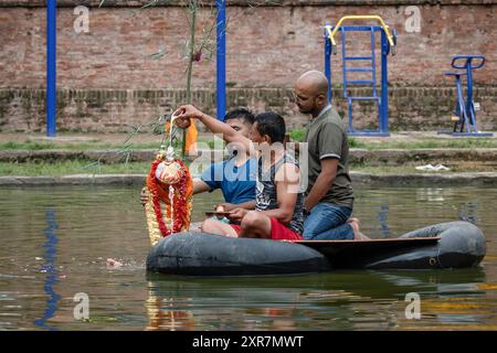 Bhaktapur, Bagmati, Nepal. 9th Aug, 2024. Locals of Bhaktapur worship the idol of serpent deity(snake) during Nag Panchami Festival. People on this day stick the poster of serpent deity(snake) on the main door step of the house, clean nearest local pond and worship snake gods, also called the Nagas during Nag Panchami. (Credit Image: © Amit Machamasi/ZUMA Press Wire) EDITORIAL USAGE ONLY! Not for Commercial USAGE! Credit: ZUMA Press, Inc./Alamy Live News Stock Photo