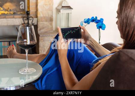 Business woman analyzing stock market trading graph financial data - Economy background Stock Photo