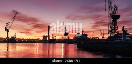 Container cargo ships at logistic port at sunset - Industrial background Stock Photo