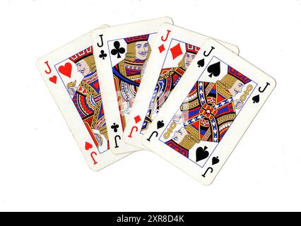 Vintage playing cards showing four jacks on a white background. Stock Photo