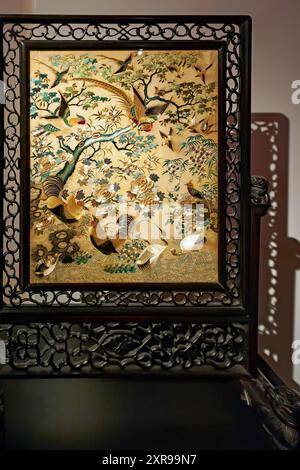 Back of the decorative ornate wooden armchair in oriental style Stock Photo