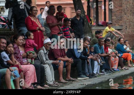 Bhaktapur, Nepal. 9th Aug, 2024. People gather during Naga Panchami in Bhaktapur, Nepal, Aug. 9, 2024. Naga Panchami is a festival of snakes and Nepali people worship the serpent deity with great reverence. Credit: Sulav Shrestha/Xinhua/Alamy Live News Stock Photo