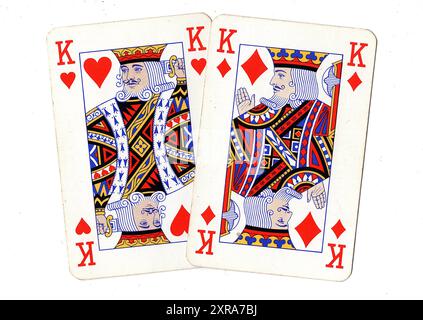 Vintage playing cards showing a pair of kings on a white background. Stock Photo