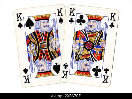 Vintage playing cards showing a pair of kings on a white background. Stock Photo