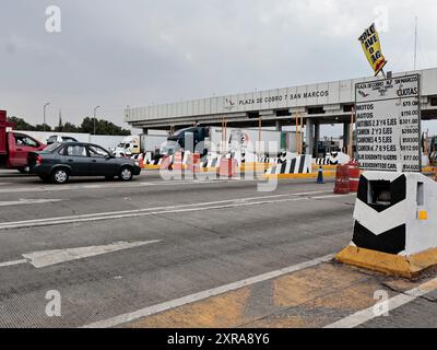 Chalco, Mexico. 08th Aug, 2024. The San Marcos toll booth on the Mexico - Puebla Highway remains blocked at Río Frío by the ejidatarios of Ignacio López Rayón in Puebla during periods of two hours closed and two hours open; This generated by the lack of payment for ejidal lands by the government sixty years ago; which has caused vehicular chaos on this stretch of the highway for almost three consecutive days for residents of nearby areas of Puebla, pedestrians and freight trucks on August 8, 2024 in Chalco, State of Mexico. (Photo by Josue Perez/Sipa USA) Credit: Sipa USA/Alamy Live News Stock Photo