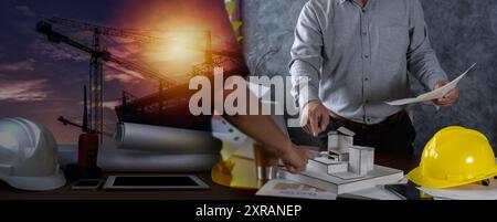 Collaborate on structural analysis of different types of projects. Engineers consulting team close up to design building blueprints paper for clients Stock Photo