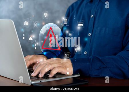 System hacked warning alert on notebook (Laptop). Cyber attack on computer network, Virus, Spyware, Malware or Malicious software. Cyber security and Stock Photo