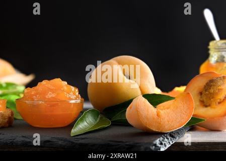 Detail of peach and fruit jam with black isolated background. Front view. Stock Photo