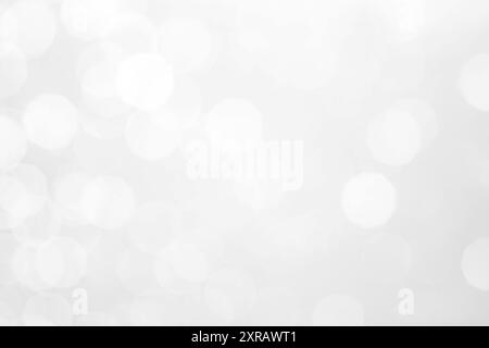 Abstract bokeh light with low light background. lights bokeh silver and white blurred. Stock Photo