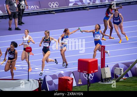 Saint Denis, France, 9th August, 2024. Athletics - Women's 4x100 metres relay round 1 - Team France passing the baton - Jacques Julien / Alamy Live News Stock Photo