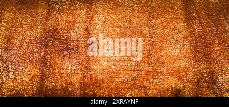 Rusty iron plate in orange and yellow tones in panoramic format. Concept textures and graphic resources. Stock Photo