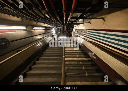Looking up an old staircase in a disused tunnel at Holborn tube station Stock Photo