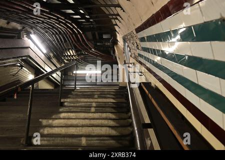 Looking up an old staircase in a disused tunnel at Holborn tube station Stock Photo