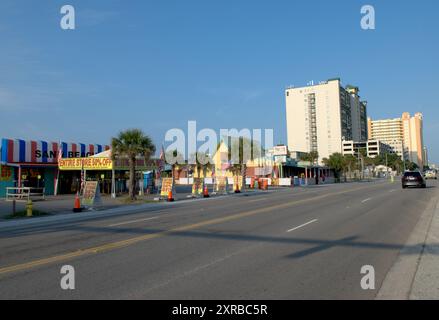 A panoramic view of the Ocean Drive skyline at North Myrtle Beach, South Carolina, showcasing a row of hotels along the expansive sandy beach. Stock Photo