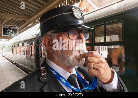 England, East Sussex, Bluebell Railway, Sheffield Park Station, Station Guard Stock Photo