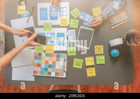 Smooth Focus, group of web designers are working together to develop mobile responsive website with UI UX Front End Designer Previewing. website desig Stock Photo