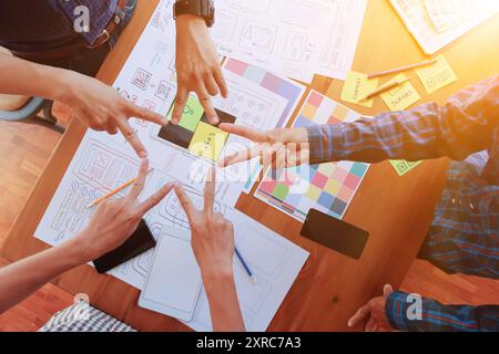 Smooth Focus, group of web designers are working together to develop mobile responsive website with UI UX Front End Designer Previewing. website desig Stock Photo