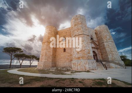 Exterior view of Castel del Monte in Apulia, Italy in sunshine with dramatic clouds Stock Photo