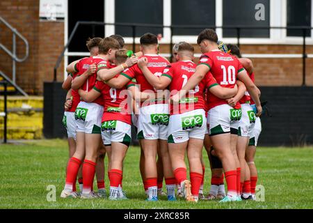 Neath, Wales. 3 August 2024. The Wales team in a huddle before kick-off in the Under 16 Four Nations Rugby League Championship game between Wales and England Community Lions at the Lextan Gnoll in Neath, Wales, UK on 3 August 2024. Credit: Duncan Thomas/Majestic Media. Stock Photo