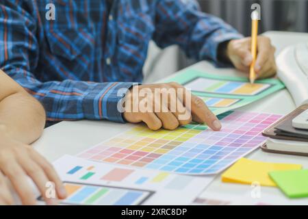 Smooth Focus, group of web designers are working together to develop mobile responsive website with UI UX Front End Designer Previewing. website desig Stock Photo