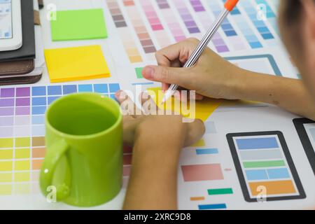Smooth Focus, group of web designers are working together to develop mobile responsive website with UI UX Front End Designer Previewing. website desig Stock Photo
