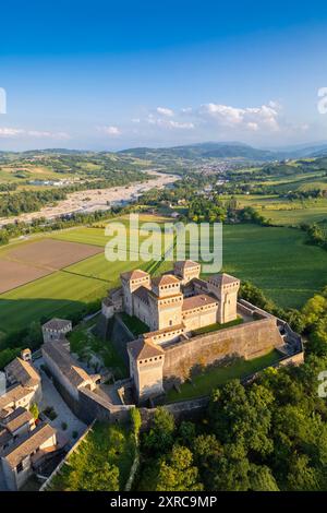 Aerial view of castle of Torrechiara during a summer sunset, Langhirano, Parma province, Emilia Romagna, Italy, Europe, Stock Photo