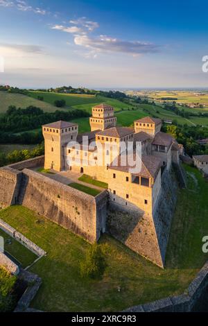 Aerial view of castle of Torrechiara during a summer sunset, Langhirano, Parma province, Emilia Romagna, Italy, Europe, Stock Photo