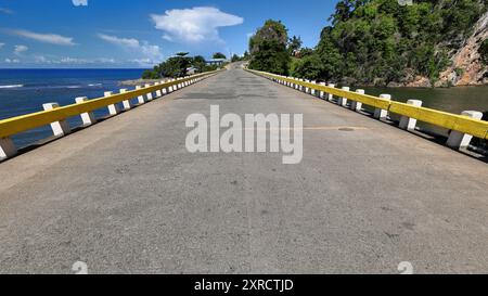 591 Highway bridge crossing the Rio Yumuri River next to its mouth in Boca de Yumuri community at the beginning of the river canyon. Baracoa-Cuba. Stock Photo