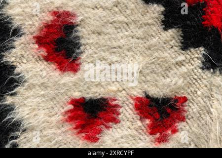 A traditional romanian wool rug background macro. Stock Photo