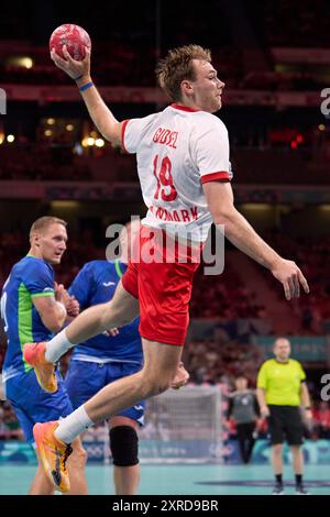 Lille, France. 9th Aug, 2024. Mathias Gidsel of Denmark shoots during the men's semifinal of handball between Slovenia and Denmark at the Paris 2024 Olympic Games in Lille, France, on Aug. 9, 2024. Credit: Meng Dingbo/Xinhua/Alamy Live News Stock Photo