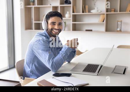 Cheerful young Arab online student guy portrait Stock Photo